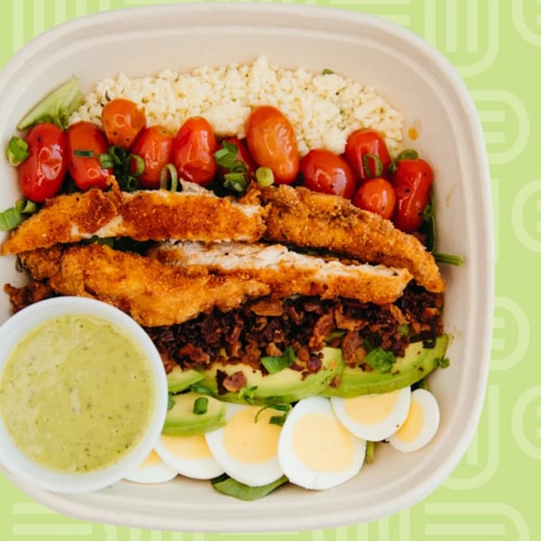 Unforked's Cobb salad with crispy chicken, avocado, eggs, tomatoes, bacon, and green dressing.